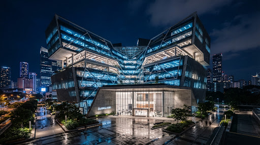 Modern industrial building at twilight, glowing with technical precision and structural integrity.